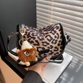Retro leopard print pillow bag with black leather trim and cute monster plush pendant - Khaki Leopard with Charm
