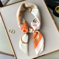 Detail of vintage pattern silk scarf with orange and beige floral motifs tied on bag - Orange (W-151)