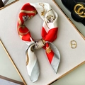 Detail of red and white silk scarf featuring vintage key and chain patterns on leather base - Red (W-151)