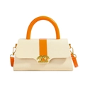 Schicke cremefarbene Web-Boxtasche mit orangefarbenem Lederbesatz und Goldverschluss - Orange