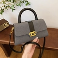 Vintage-Box-Tasche aus grauem Canvas mit schwarzen Lederdetails und Goldschloss - Schwarz