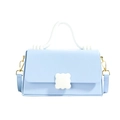 Elegant light blue crossbody bag with white handle and floral clasp detail - Blue