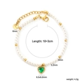 Detail of beaded pearl bracelet with green heart stone and stainless steel lobster clasp - Green Heart Faux Gemstone Bracelet (BR28130JG)