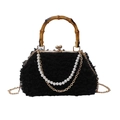 Black faux fur shell bag featuring a natural bamboo handle and pearl chain strap - Black