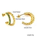 Detail view of gold-plated stainless steel C-shape earrings with green zircon stones - C-Shaped Row Pave Green Gem Earrings (EA31640JG)