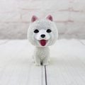 Close-up of cute Samoyed resin car ornament with detailed fur texture and happy expression - Samoyed