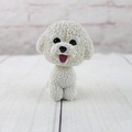 Detailed macro view of white Bichon dog ornament showing realistic resin fur texture - Bichon Frise
