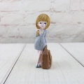 Detail of cartoon businesswoman resin figurine in grey checkered suit on wood surface - Gray Plaid Office Suit Skirt (Naier Girl B)