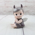 Close-up of a sitting resin angel figure with grey hair and white wings as a cake topper - Keller Sitting Small Style A (1046-4)