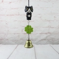 Detail of black and white cat charm with green clover and antique bronze bell pendant - Black and White Cat Wind Chime Pendant