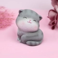 Close-up of a grey resin cat figurine with textured fur and a peaceful smile - Curled Smiling Style B (1082-5) / Single Piece