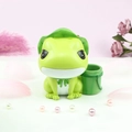 Detail view of cute green frog figurine with lotus leaf hat and bamboo storage jar - Bamboo Tube Pen Holder Money Box