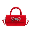 Red leather shoulder bag with crystal bow detail and silver metal handle - Red