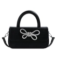 Elegant black leather handbag with a sparkling silver rhinestone bow and top handle - Black