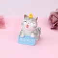 Detail of grey tabby cat resin figurine with yellow duck and blue 'Pressure' sign - Feeling Pressure (2A)