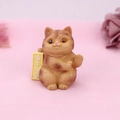 Close-up of resin cat ornament with yellow sign featuring funny Chinese text - Observing Secretly (2B)
