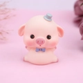 Cute pink pig figurine with grey top hat and purple bow for cake decoration and room decor - Sitting Eyes Open