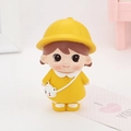 Close-up of a cute cartoon girl figurine in yellow dress with a bear bag for desk decor - Yellow Hat Girl (1B)