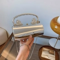 Silver metallic cylinder evening bag with lion head accents and elegant metal chain strap - Silver