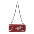 Red crossbody bag with silver butterfly patches and a delicate metal chain strap - Red
