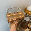 Elegant rose gold cylindrical evening bag with silver lion head handle and chain - Rose Gold