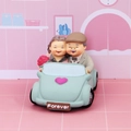 Smiling elderly couple in a blue classic car figurine with Forever license plate decor - Sweet Travel (Old Couple in Car)