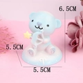 Cute blue bear figurine holding a star bow for cake decoration and car interiors - Sagittarius (7510K)
