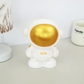 Astronaut piggy bank in matte white with golden rich emblem and face shield - Gold Style