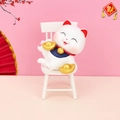 Lucky cat car and desk ornament with gold ingots on a white wooden chair - Sitting Lucky Cat Holding Ingot (D)