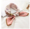 Pink silk scarf with shell and leaf prints tied elegantly on a white book surface - 53*53cm / Pink