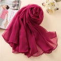 Detailed texture of dark pink lightweight chiffon scarf with elegant vertical ripples - Carmine
