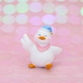 Cute duck car ornament with blue sleep hat and pink scarf on a sparkly pink base - Mini White Duck with Blue Sleeping Hat and Pink Scarf