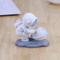 Creative astronaut desk lamp on Little Star base touching a blue ringed planet model - Pushing Ball Pose (2711-9B) / Astronaut Planet Night Light (Blue Silver Trim)