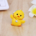 Cute yellow resin duck figurine wearing silver headphones and camera on wooden desk - Headphone & Camera Style - Yellow