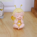 Cute yellow fairy baby figurine with wings in a resting pose for desk decor - Sitting Bee with Cheeks Resting (Yellow)