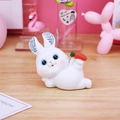 Cute white cartoon bunny figurine holding a carrot with sparkly rhinestone ears decor - Style C Rhinestone-studded Playful Rabbit Ornament / As Shown