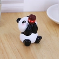 Cute panda resin figurine holding a red salary jar for desk and car decor - Panda Style