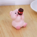 Cute pink pig resin ornament holding a slim water bottle for car and desk decor - Pink Piggy Style