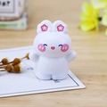 Cute white bunny figurine with pink floral ears for office and car dashboard decor - Hugging Pose (D Chacha)