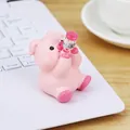 Pink resin pig car ornament holding bottle, creative desktop decoration gift, 70mm height - Dizzy Pig Style