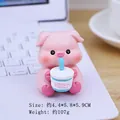 Pink pig figurine holding milk tea, cute resin desk ornament for car or office decor - Milk Tea Pig Style