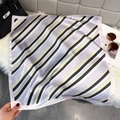 Elegant geometric striped silk scarf for women in lavender and beige tones, lifestyle view - Light Purple