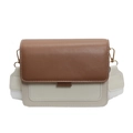 Chic two-tone crossbody bag featuring brown leather flap and beige textured body - Brown