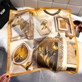 Detailed view of French vintage print silk scarf with yellow edges on a plush background - 65*65cm / Ginger Yellow