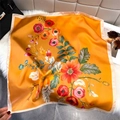 Vibrant orange floral silk square scarf with satin finish on white plush background - Bandana / Orange