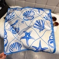 Macro detail of silk scarf featuring hand-drawn mermaid, starfish and coral prints - Ocean Seashell Print / Royal Blue