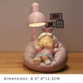Pink creative night light resin figure of a smiling lady with lemon slice on a wooden desk - Lazy Moment - Grandma Night Light