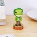 Cute green frog spring dashboard ornament with lotus leaf hat on wood base - Frog With Hat Spring Ornament (0389A)