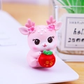 Pink cartoon deer figurine holding a red apple with lucky gold characters - Deer of Peace
