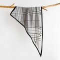 Detailed macro view of black and white geometric silk scarf draped on a wooden branch - White (SJ-34)